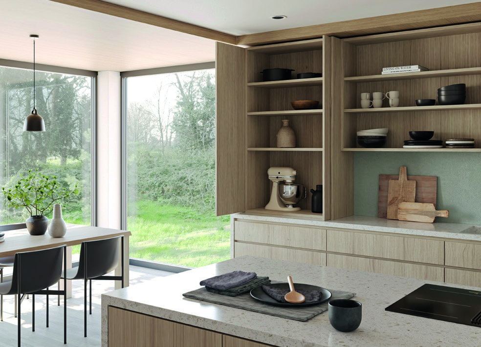 A kitchen with the Exedra Gravity IN pocket doors slid back into the cabinet